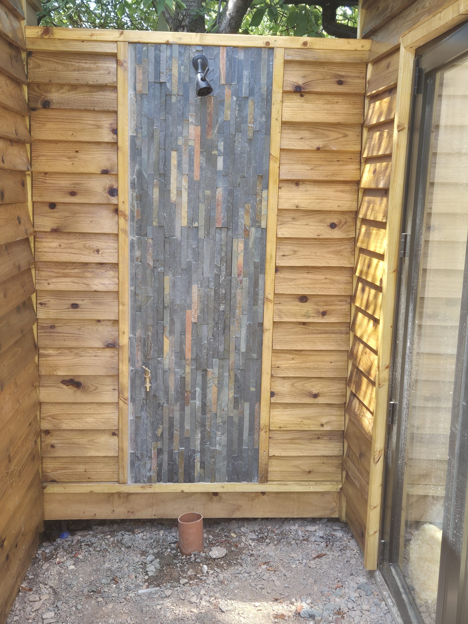 Sauna wall framing during construction showing timber frame structure